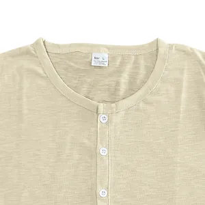 Macro detail of men's Henley T-shirt neckline with buttons and slub texture