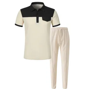 Completo uomo due pezzi in maglia a nido d'ape con polo color block e pantaloni