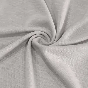 Detailed macro view of light grey slub cotton fabric texture for men's vintage casual T-shirt