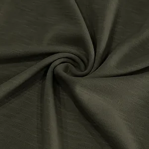 Close-up macro detail of vintage imitation slub cotton fabric in dark olive green