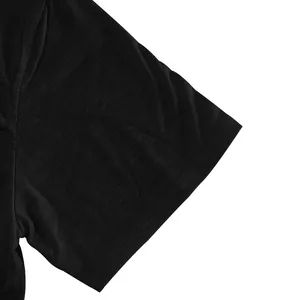 Detailed view showing the texture of the sleeve cuff on a black slub cotton t-shirt