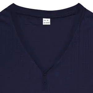 Close-up detail of a navy blue Henley shirt neckline showing textured slub fabric