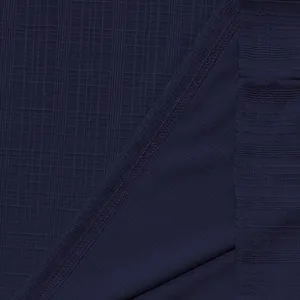 Close-up macro view of navy blue slub fabric texture with professional stitching