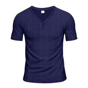 Close-up of navy blue Henley t-shirt showing waffle texture and V-neck button detail.