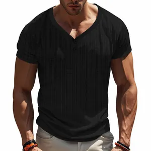 Detailed macro view of black textured Henley shirt featuring V-neckline and button placket.