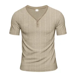 Close-up of a men's khaki short sleeve Henley t-shirt with a subtle waffle texture