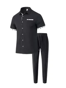 Herren 2-Teiler Freizeit-Set mit Kurzarm-Polo und Jogginghose in schwarzem Waffelstrick.