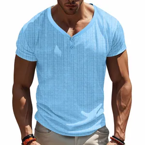 Detailed view of men's light blue waffle knit Henley t-shirt featuring a buttoned V-neckline