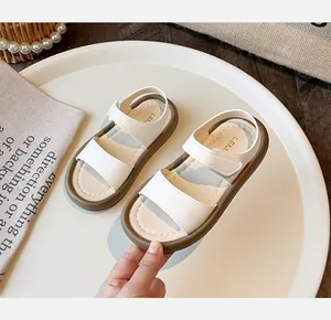 Detailed view of minimalist white girls sandals with soft thick sole for summer beach
