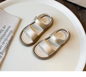 Detailed view of champagne gold girls sandals with soft sole and hook-and-loop straps