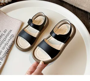 Minimalist black and white kids sandals with soft durable soles for summer wear