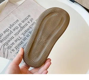 Macro view of brown anti-slip rubber sole for children girls summer sandals