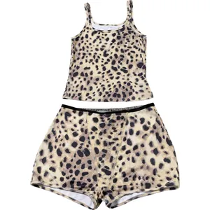 Detailed flat lay of chic leopard print camisole and matching high-waisted shorts set