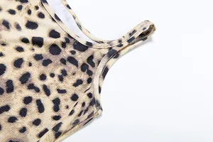 Detailed macro view of the ribbed fabric and strap stitching on a leopard print camisole top