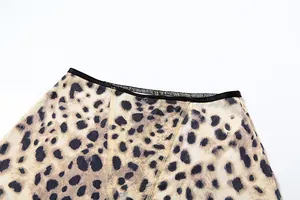 Close-up detail showing the fine leopard print pattern and black elastic waistband stitching
