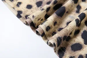 Close-up detail of leopard print ribbed fabric with high-quality hemline stitching