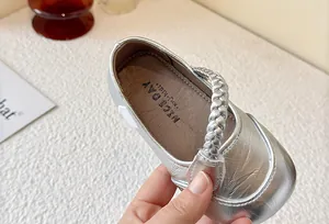 Elegant silver metallic girls Mary Jane shoes with braided strap and soft non-slip sole
