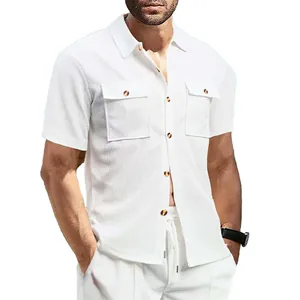 Close-up of white waffle knit short-sleeve shirt with dual chest pockets and brown buttons.