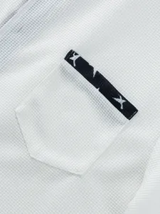 Close-up of waffle knit texture and contrast star pattern pocket on men's T-shirt.