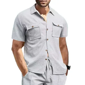Detail view of men's light grey waffle knit short sleeve shirt with chest pockets