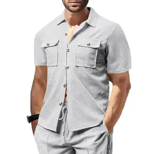 Detail shot of men's waffle knit short sleeve casual shirt with chest pockets in grey.