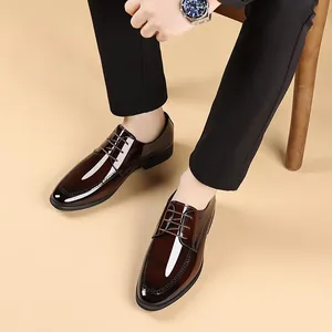 Elegant men's glossy brown leather dress shoes for formal business or wedding events.