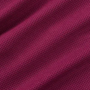 Macro view showing the detailed waffle weave texture of the burgundy t-shirt fabric