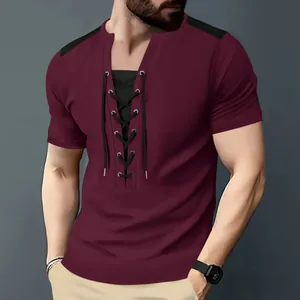 Close-up detail of a men's burgundy waffle knit t-shirt featuring a lace-up neckline