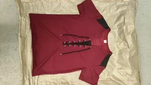 Detail view of maroon waffle knit men's T-shirt with lace-up neck and mesh shoulders