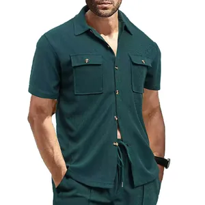 Close-up of men's dark green waffle knit workwear shirt with buttoned chest pockets