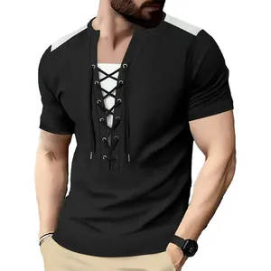 Detail of men's black waffle knit t-shirt with lace-up neckline and contrast shoulders