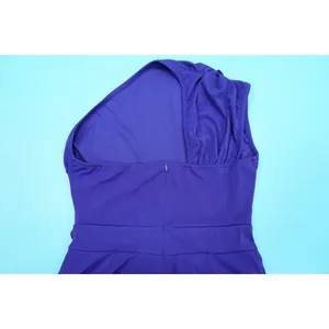 Back detail of a purple one-shoulder dress showing concealed zipper and waist design