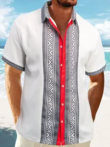 Close-up of men's waffle knit shirt with ethnic geometric print and red placket detail.