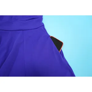Detail view of side pocket on royal blue flared dress showing smartphone storage