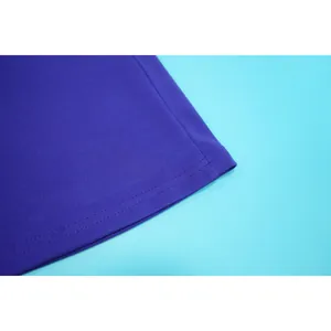 Close-up detail of the smooth double-stitched hemline on a purple sleeveless dress