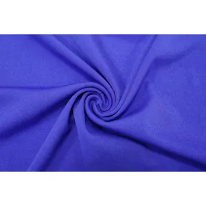 Macro shot of premium royal blue elastic knit fabric texture for stylish summer dress.