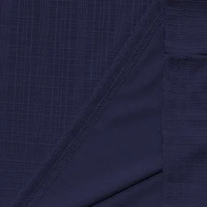 Close-up of dark navy slub fabric texture with detailed stitching on Henley shirt