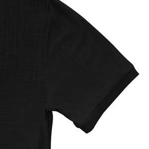 Close-up of black textured slub fabric on men's vintage short sleeve Henley shirt