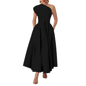 Detail of elegant black one-shoulder maxi dress with cinched waist and flared skirt