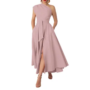 Sleeveless one-shoulder maxi dress with a waist belt and front slit in dusty pink.