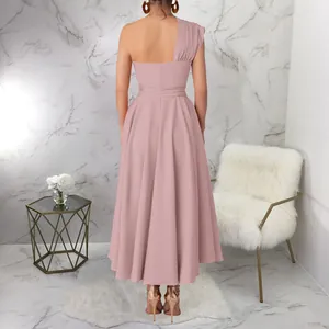 Back view of a stylish dusty pink one-shoulder sleeveless waisted large swing maxi dress.