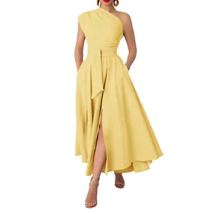 Close-up detail of elegant yellow one-shoulder sleeveless maxi dress with a waist belt