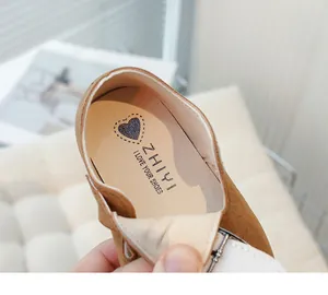 Detailed close-up of the soft insole of a child's vintage leather shoe