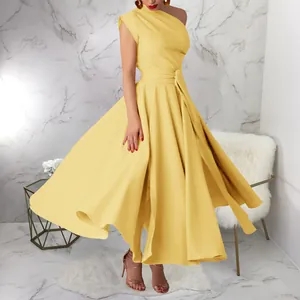 Elegant one-shoulder yellow maxi dress with waist tie and large swing skirt style