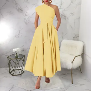 Front view of yellow one-shoulder sleeveless maxi dress with belted waist details