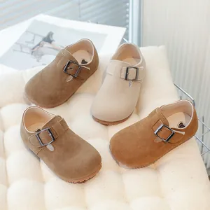 Classic retro children's suede loafers featuring stylish buckle straps in earthy tones