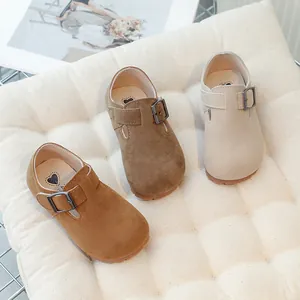 Kids stylish suede Birkenstock style shoes with metal buckles in three earth tones