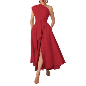 Elegant model wearing a vibrant red one-shoulder sleeveless maxi dress with a waist belt and slit