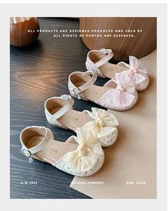 Detailed view of girls' princess sandals with elegant lace bows and butterfly print