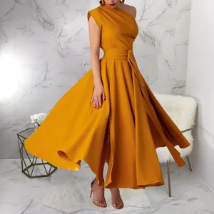Elegant mustard yellow one-shoulder sleeveless dress with flared hem and waist belt.